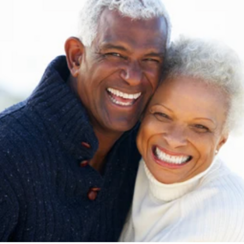 Gifts to husband, partners are in love. Women is holding a flower in her hand. Partners are smiling and very happy to be with other. 